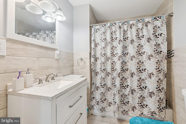 321 Taft St, Bristol, PA 19007 - bathroom with tile walls, vanity, shower / tub combo with curtain, tile patterned flooring, and a wainscoted wall