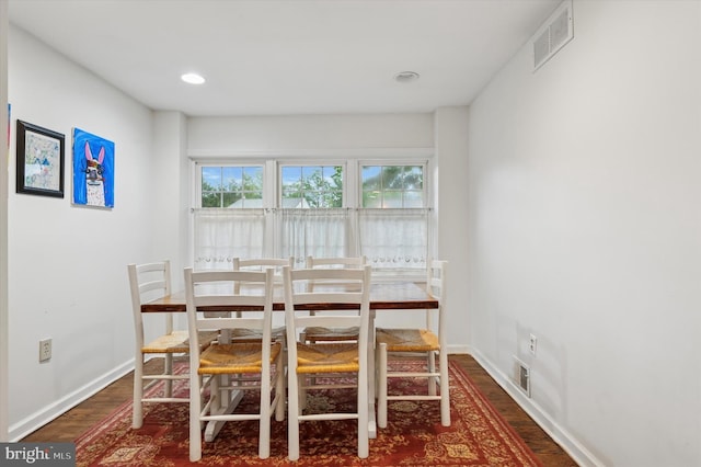 dining space with wood finished floors, baseboards, and recessed lighting