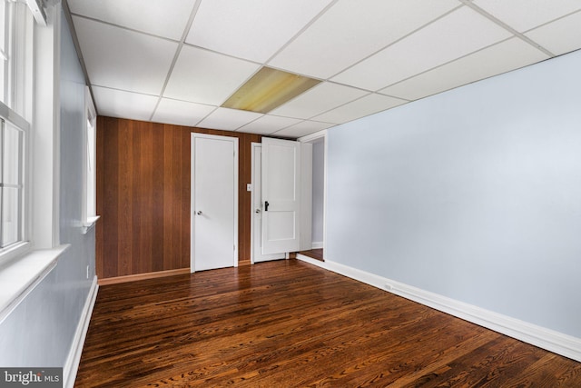 812 Pleasant Hill Rd, Wallingford, PA 19086 - spare room featuring baseboards, dark wood-type flooring, and a drop ceiling