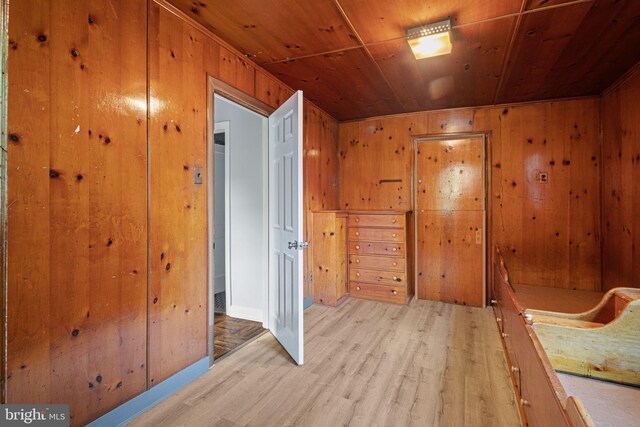 812 Pleasant Hill Rd, Wallingford, PA 19086 - unfurnished bedroom with wooden ceiling, light wood-style flooring, and wooden walls