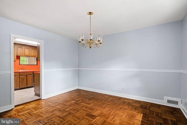 812 Pleasant Hill Rd, Wallingford, PA 19086 - empty room with a sink, a chandelier, and baseboards