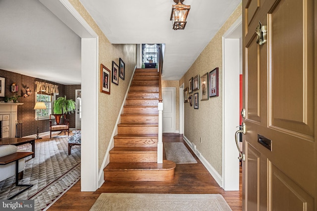 100 Chesney Ln, Erdenheim, PA 19038 - entryway featuring wallpapered walls, dark wood-style floors, stairway, and baseboards