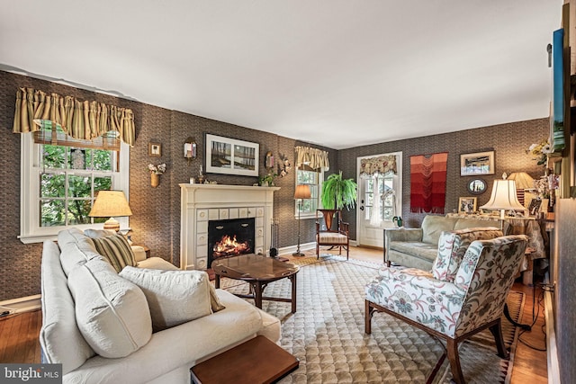 100 Chesney Ln, Erdenheim, PA 19038 - living area featuring wood finished floors, wallpapered walls, a fireplace, and baseboards