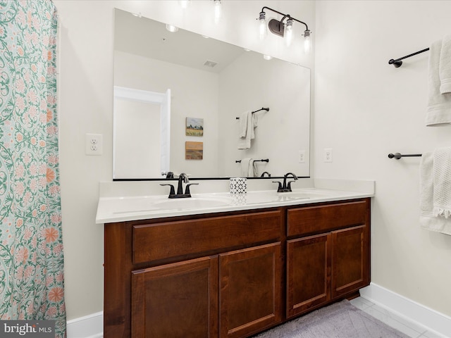 525 Leftwich Ln Unit 78, Annapolis, MD 21401 - bathroom featuring double vanity and baseboards