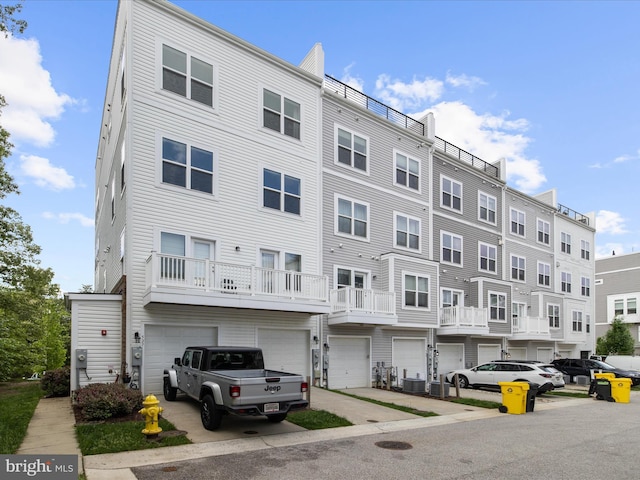 525 Leftwich Ln Unit 78, Annapolis, MD 21401 - view of property featuring a garage, central AC unit, and driveway