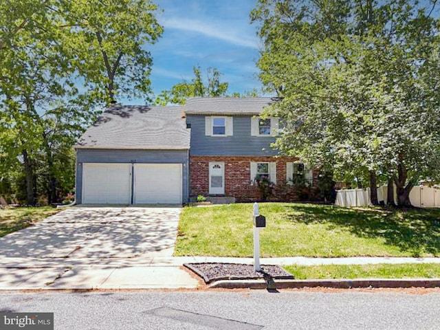 112 Hemlock Dr, Williamstown, NJ 08094 - colonial home featuring an attached garage, concrete driveway, and brick siding