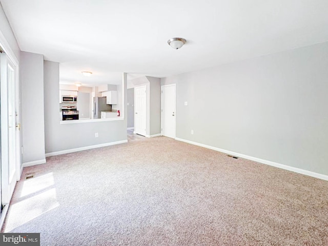 112 Hemlock Dr, Williamstown, NJ 08094 - unfurnished living room featuring light colored carpet and baseboards
