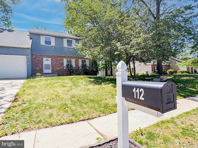 112 Hemlock Dr, Williamstown, NJ 08094 - view of front facade with a garage, a front lawn, driveway, and brick siding