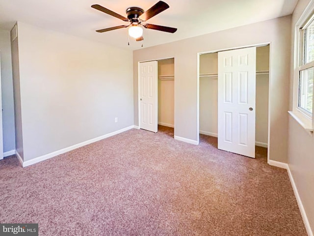 112 Hemlock Dr, Williamstown, NJ 08094 - unfurnished bedroom featuring two closets, carpet floors, multiple windows, and baseboards