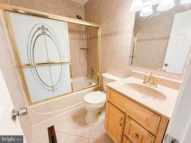 112 Hemlock Dr, Williamstown, NJ 08094 - bathroom with tile walls, vanity, toilet, bath / shower combo with glass door, and tile patterned floors