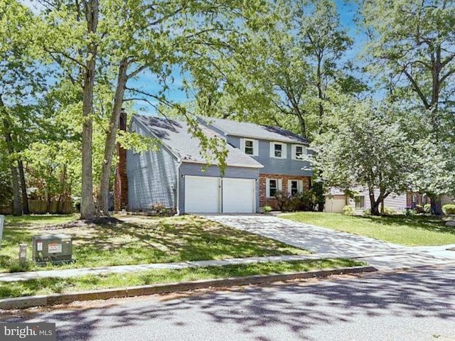 112 Hemlock Dr, Williamstown, NJ 08094 - view of front of house with driveway, a front yard, a garage, and brick siding