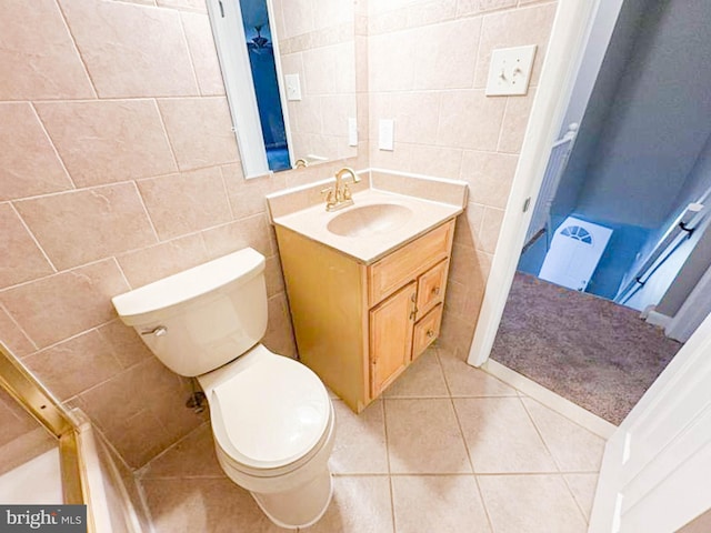 112 Hemlock Dr, Williamstown, NJ 08094 - bathroom with tile walls, toilet, vanity, and tile patterned floors