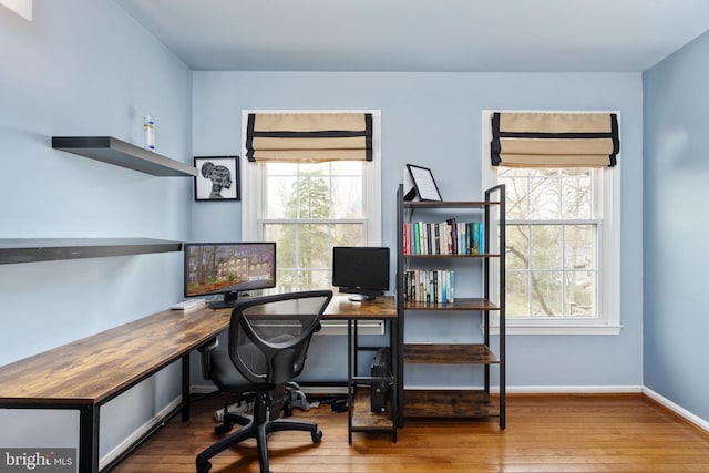 office area featuring hardwood / wood-style floors and baseboards