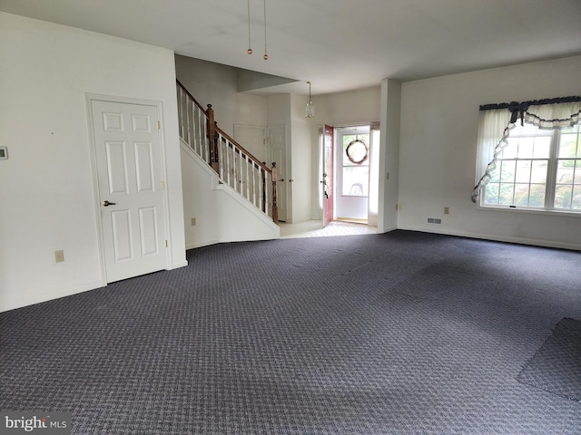 16 Lantern Ln, Columbus, NJ 08022 - entryway with dark carpet, stairway, plenty of natural light, and baseboards