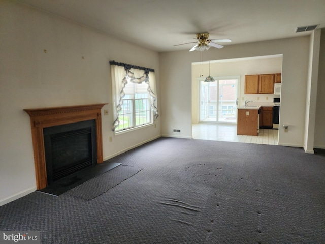16 Lantern Ln, Columbus, NJ 08022 - unfurnished living room with plenty of natural light, carpet, and ceiling fan