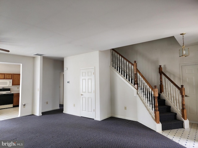 16 Lantern Ln, Columbus, NJ 08022 - unfurnished living room featuring stairs, baseboards, carpet flooring, and a ceiling fan