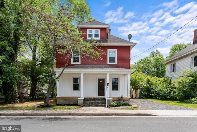 10 E Chestnut St, Delmar, MD 21875 - american foursquare style home featuring roof with shingles, a porch, and driveway