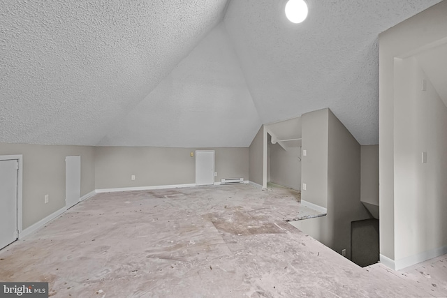 10 E Chestnut St, Delmar, MD 21875 - additional living space with a textured ceiling, lofted ceiling, baseboards, and a baseboard radiator