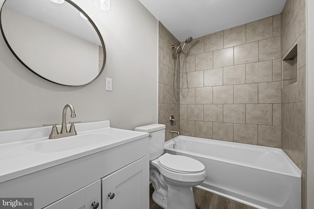 10 E Chestnut St, Delmar, MD 21875 - full bathroom featuring wood finished floors, toilet, vanity, and washtub / shower combination