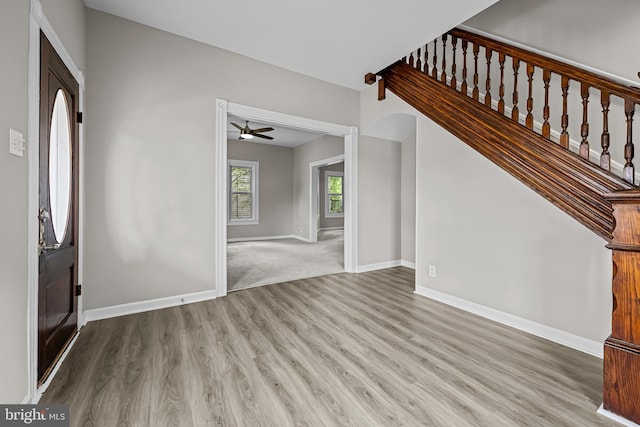 10 E Chestnut St, Delmar, MD 21875 - entryway with wood finished floors, baseboards, a ceiling fan, and stairs