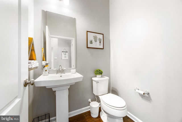 5519 Golden Eagle Rd, Frederick, MD 21704 - half bath with toilet, baseboards, wood finished floors, and a sink