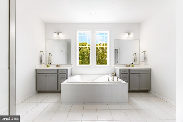 5519 Golden Eagle Rd, Frederick, MD 21704 - full bathroom featuring a garden tub, two vanities, tile patterned floors, and baseboards
