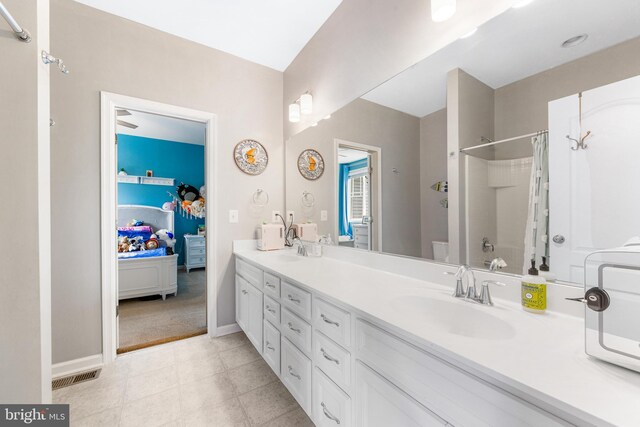 5519 Golden Eagle Rd, Frederick, MD 21704 - full bath with ensuite bathroom, a shower with shower curtain, double vanity, and baseboards