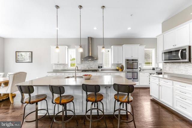 5519 Golden Eagle Rd, Frederick, MD 21704 - kitchen with wall chimney exhaust hood, appliances with stainless steel finishes, a sink, decorative backsplash, and recessed lighting