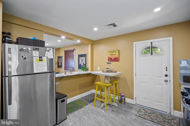 449 7th Ave, Lindenwold, NJ 08021 - kitchen with stainless steel appliances, baseboards, recessed lighting, marble finish flooring, and a breakfast bar