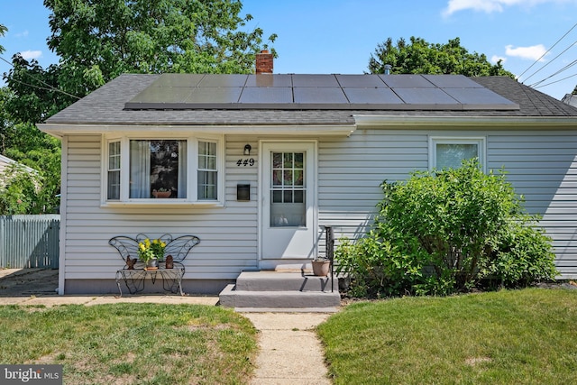 449 7th Ave, Lindenwold, NJ 08021 - view of front of property with a chimney, roof mounted solar panels, and roof with shingles