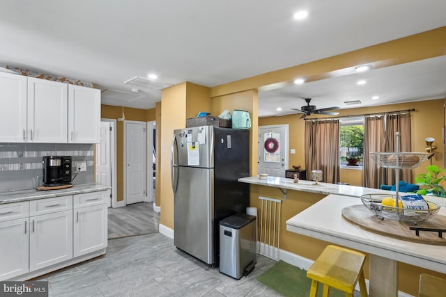 449 7th Ave, Lindenwold, NJ 08021 - kitchen with freestanding refrigerator, white cabinets, recessed lighting, decorative backsplash, and a ceiling fan