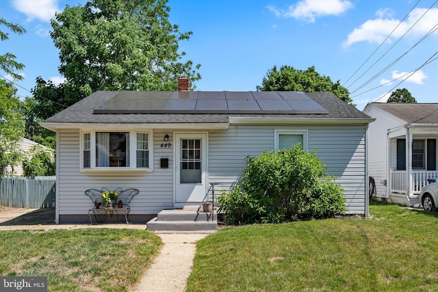 449 7th Ave, Lindenwold, NJ 08021 - bungalow-style home featuring a chimney, solar panels, and roof with shingles