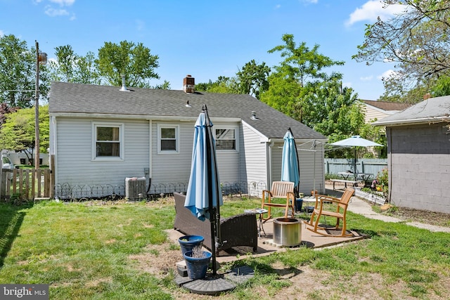 449 7th Ave, Lindenwold, NJ 08021 - back of property with an outdoor fire pit, central AC, a chimney, and a patio