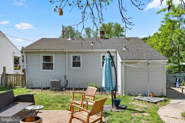 449 7th Ave, Lindenwold, NJ 08021 - rear view of property featuring a patio area, a fire pit, a chimney, and roof with shingles