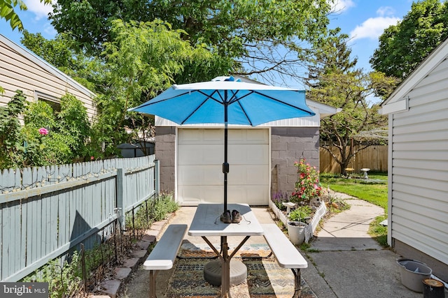 449 7th Ave, Lindenwold, NJ 08021 - view of patio / terrace with an outdoor structure, a fenced backyard, and a detached garage