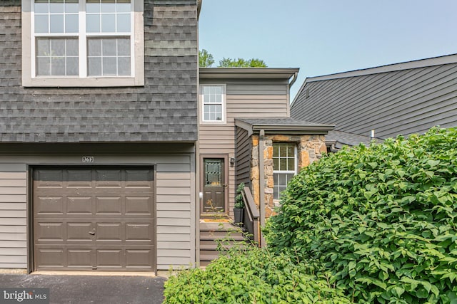 36F Needham Way, Princeton, NJ 08540 - view of front of home featuring a garage and a shingled roof