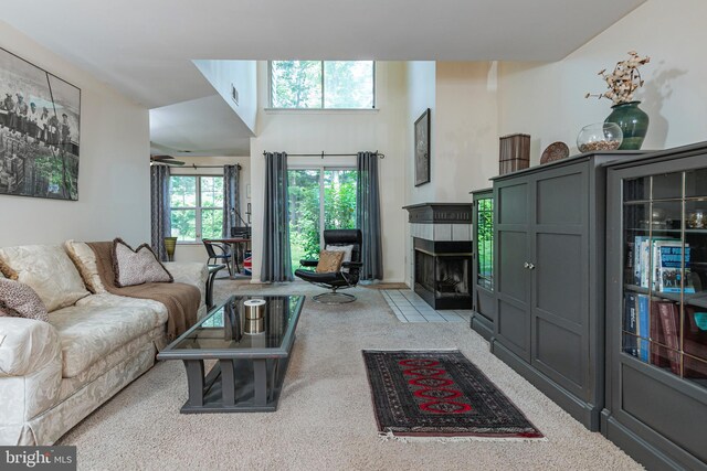 36F Needham Way, Princeton, NJ 08540 - carpeted living area featuring a tile fireplace and a ceiling fan