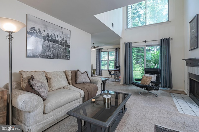36F Needham Way, Princeton, NJ 08540 - carpeted living area with a tiled fireplace and a high ceiling