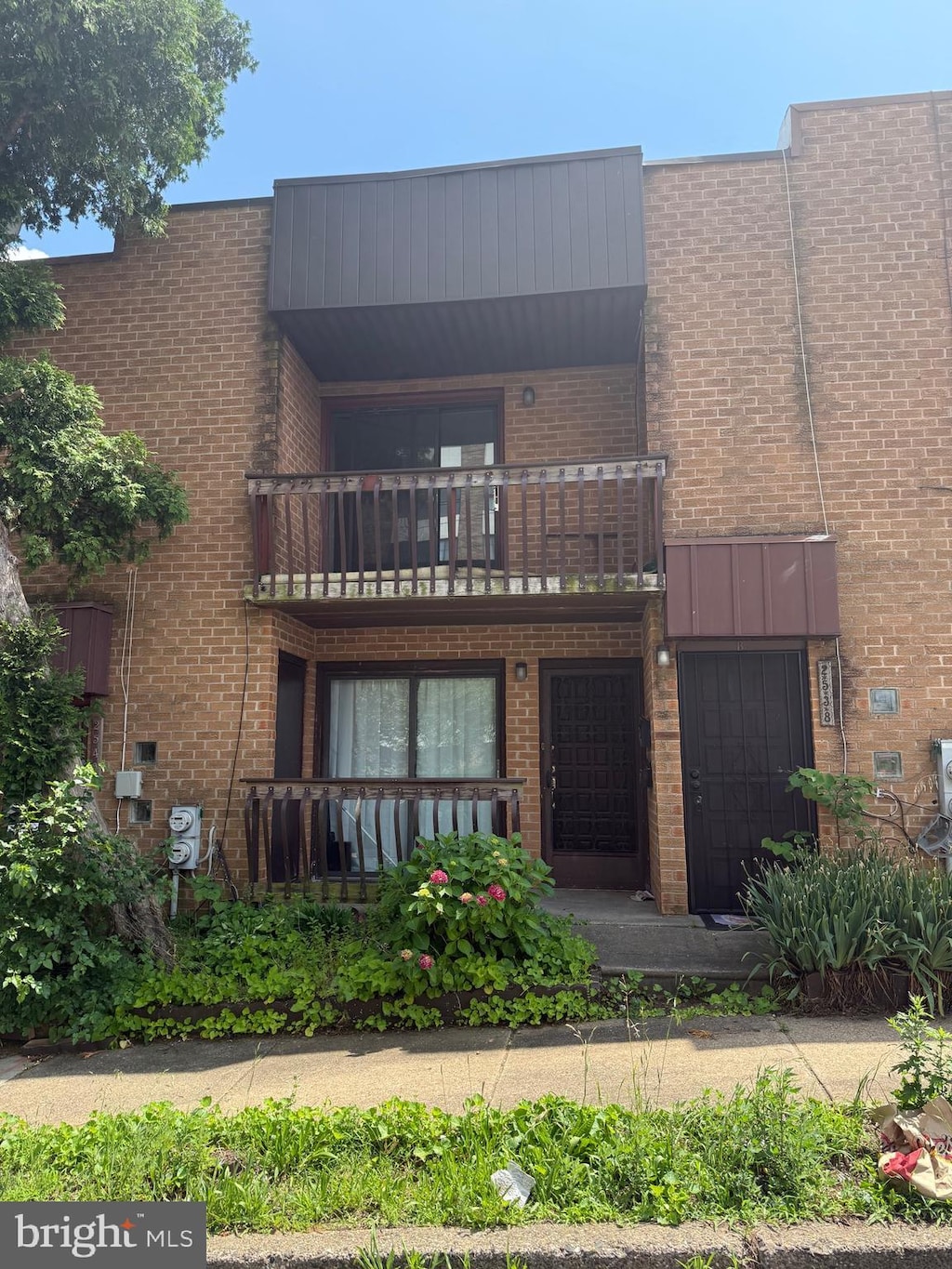 2538 Faunce St, Philadelphia, PA 19152 - view of front of property with a balcony and brick siding