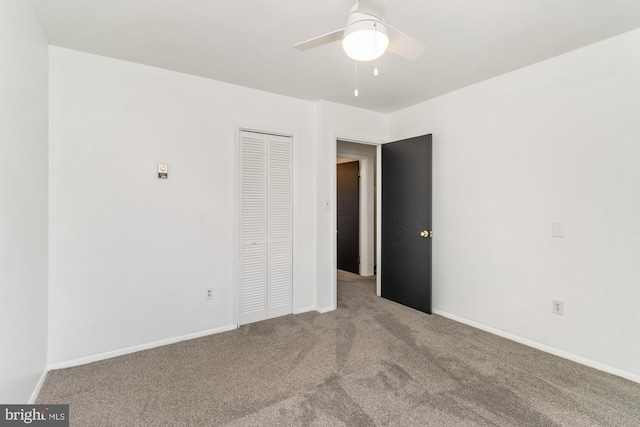 3135 Sollers Point Rd, Baltimore, MD 21222 - unfurnished bedroom with carpet flooring, a closet, baseboards, and ceiling fan