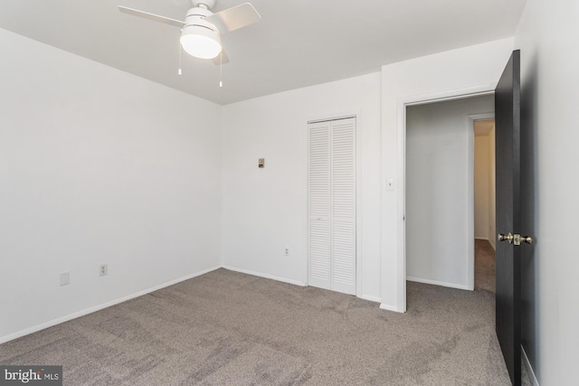 3135 Sollers Point Rd, Baltimore, MD 21222 - unfurnished bedroom featuring carpet, a closet, baseboards, and ceiling fan
