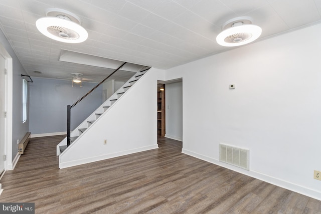 3135 Sollers Point Rd, Baltimore, MD 21222 - below grade area featuring stairs, wood finished floors, a baseboard radiator, baseboards, and a ceiling fan