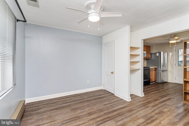 3135 Sollers Point Rd, Baltimore, MD 21222 - unfurnished living room featuring a ceiling fan, baseboard heating, dark wood-type flooring, ornamental molding, and baseboards