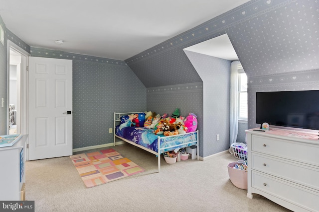 carpeted bedroom with wallpapered walls and baseboards