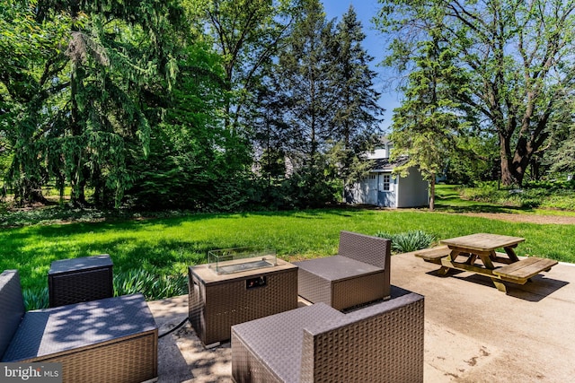 view of patio featuring an outbuilding