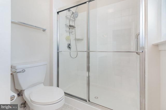 full bath with a shower stall and toilet
