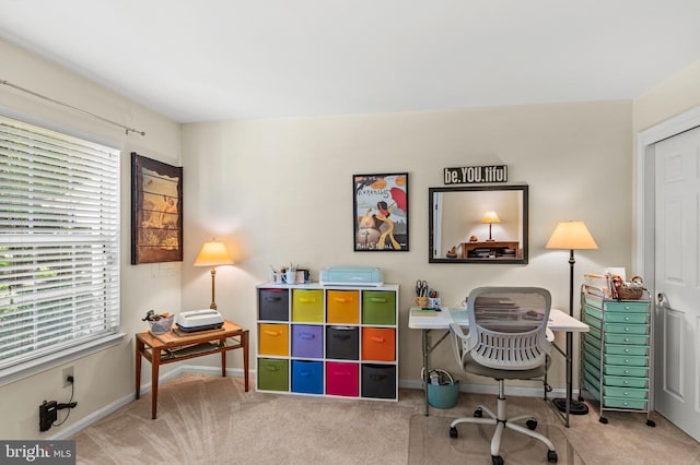 home office with carpet, plenty of natural light, and baseboards