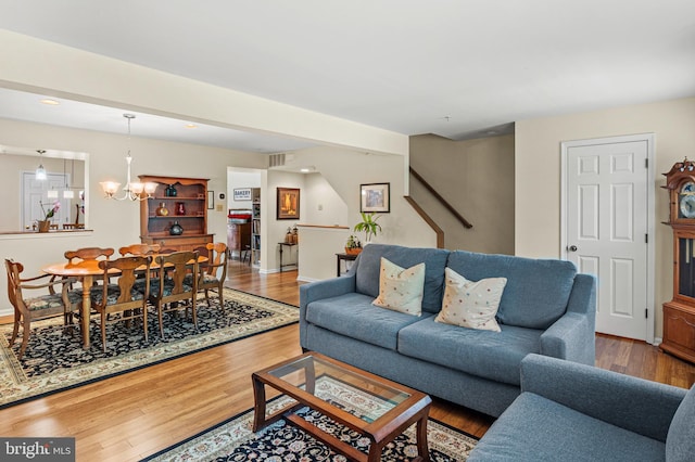 living room with wood finished floors, recessed lighting, stairway, and baseboards