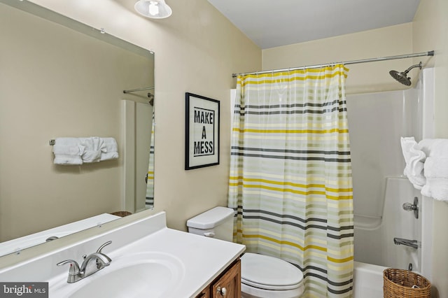 full bath with toilet, vanity, and shower / bath combo