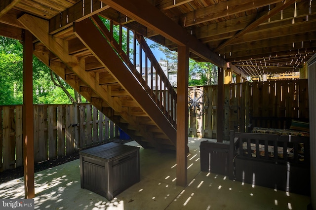 view of patio / terrace with stairs and a fenced backyard